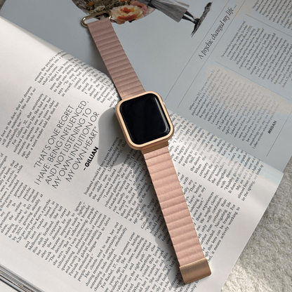 Smartwatch with a pink band on an open book with a Metal stainless steel apple watch case cover