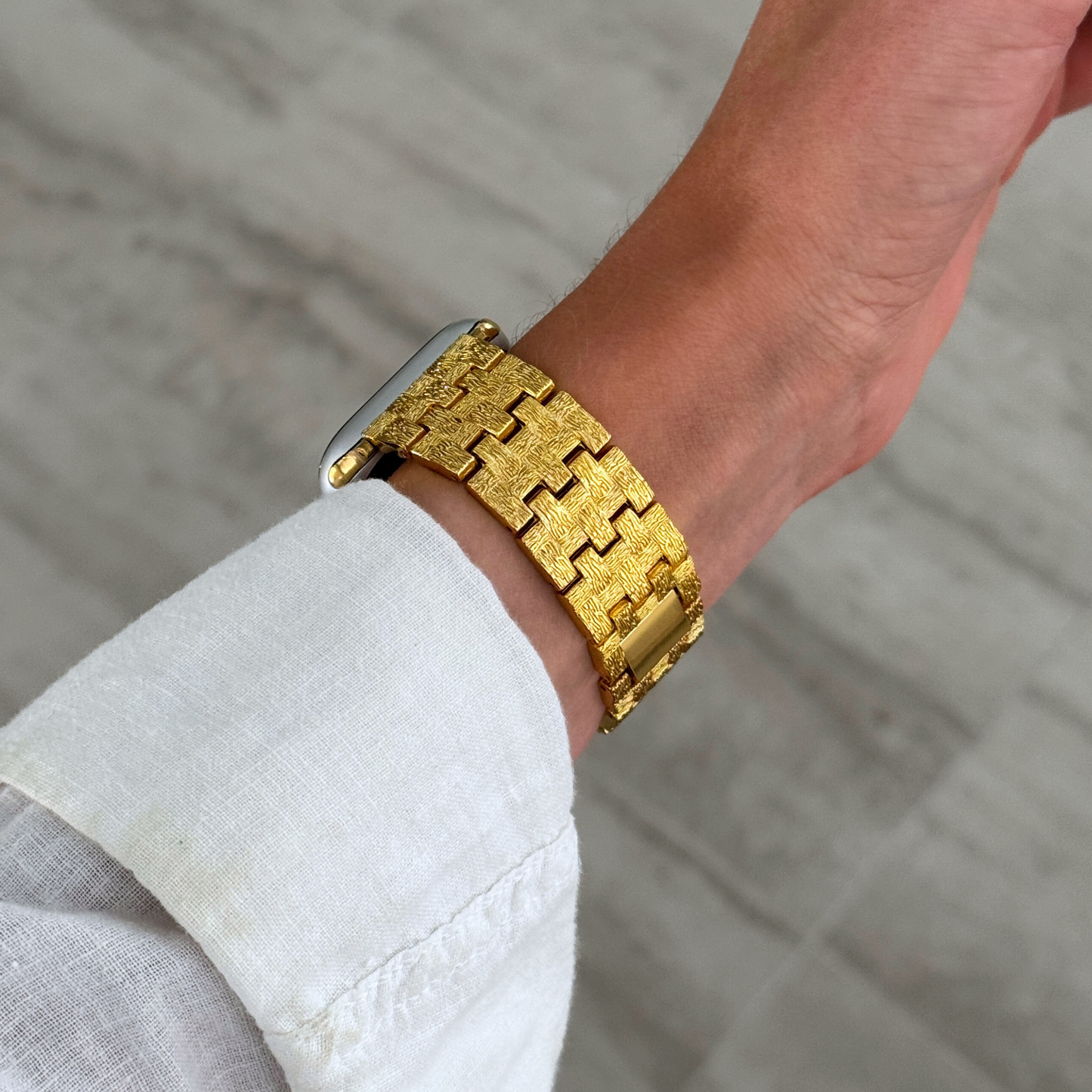 Vintage-inspired stainless steel Apple Watch band with an intricate baroque pattern. Features a mix of brushed matte and polished shine for a luxurious look. Compatible with Apple Watch Series 1-10, SE, and Ultra.