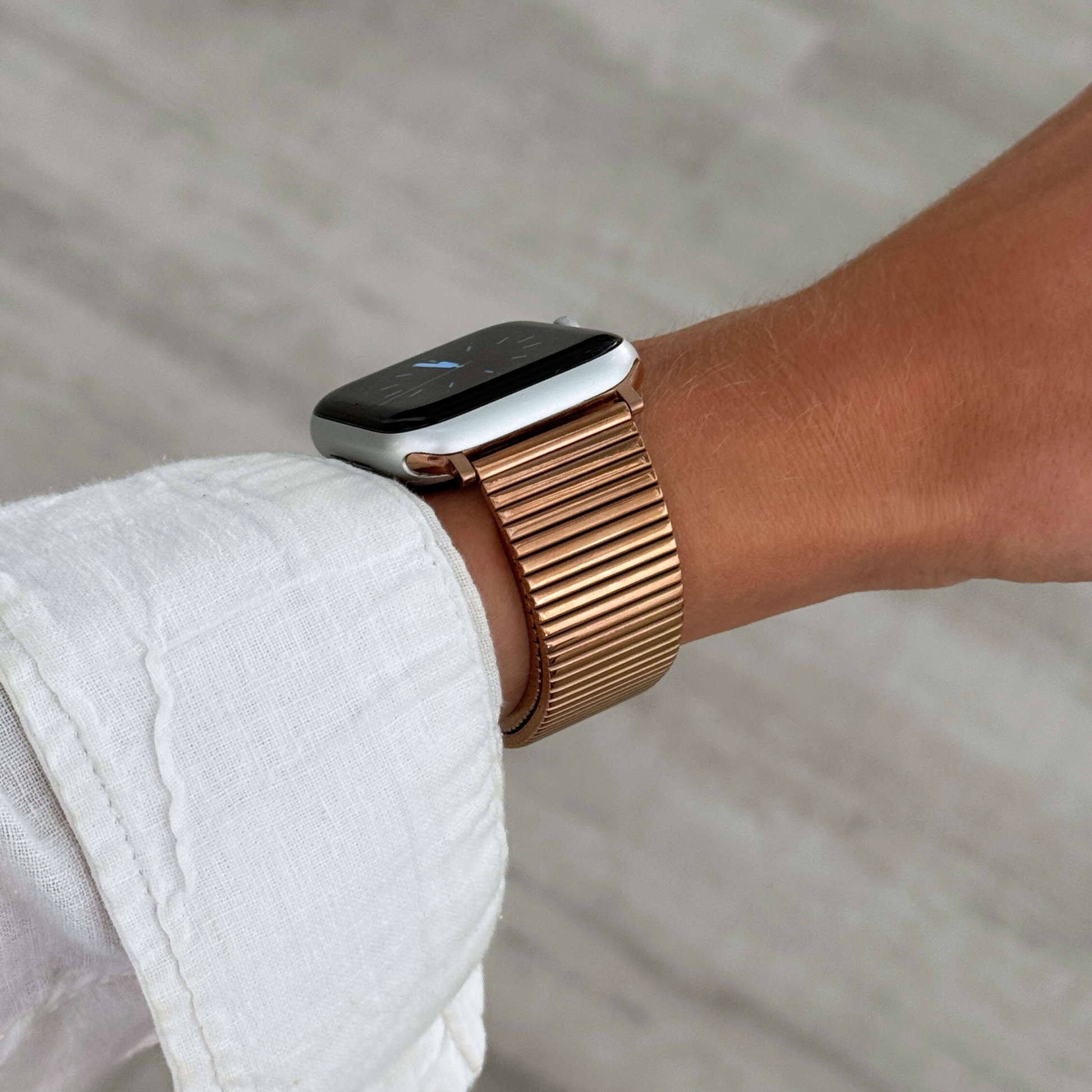 Stainless steel, waterproof Apple Watch band with a chic loop design. Features a multi-color finish and an easy-to-resize design for a perfect fit. Compatible with Apple Watch Series 1-10, SE, and Ultra.