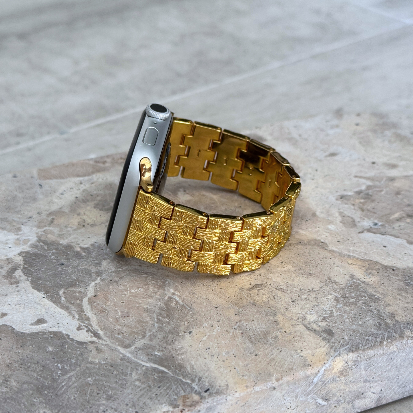 Vintage-inspired stainless steel Apple Watch band with an intricate baroque pattern. Features a mix of brushed matte and polished shine for a luxurious look. Compatible with Apple Watch Series 1-10, SE, and Ultra.