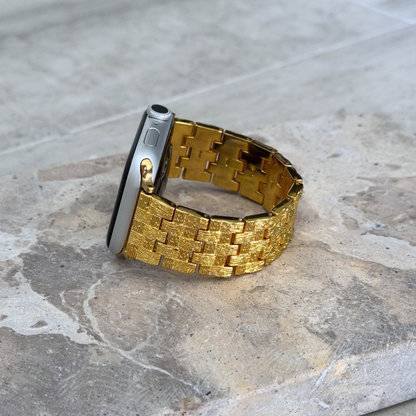 Vintage-inspired stainless steel Apple Watch band with an intricate baroque pattern. Features a mix of brushed matte and polished shine for a luxurious look. Compatible with Apple Watch Series 1-10, SE, and Ultra.