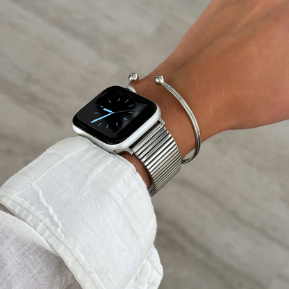 Stainless steel, waterproof Apple Watch band with a chic loop design. Features a multi-color finish and an easy-to-resize design for a perfect fit. Compatible with Apple Watch Series 1-10, SE, and Ultra.