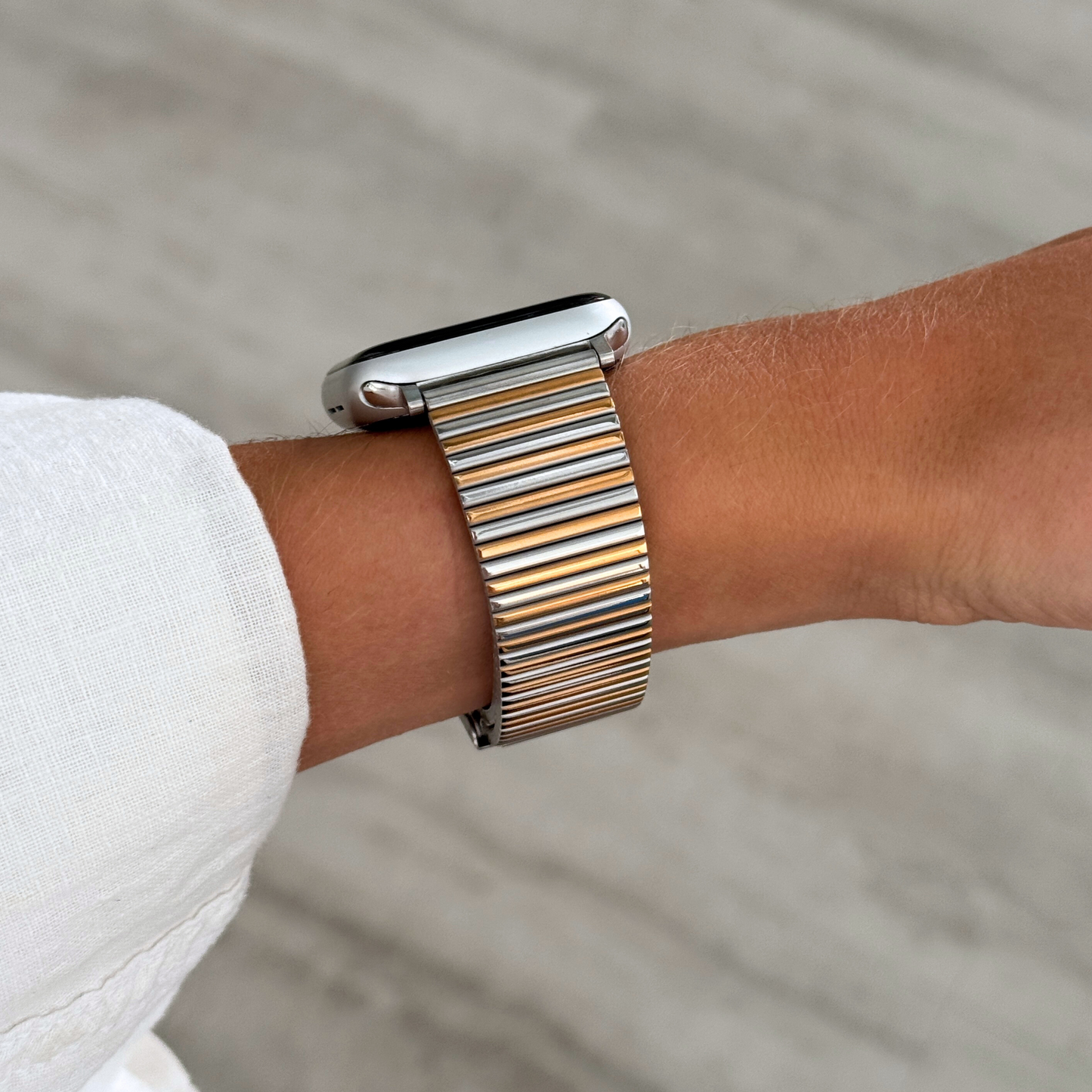 Stainless steel, waterproof Apple Watch band with a chic loop design. Features a multi-color finish and an easy-to-resize design for a perfect fit. Compatible with Apple Watch Series 1-10, SE, and Ultra.