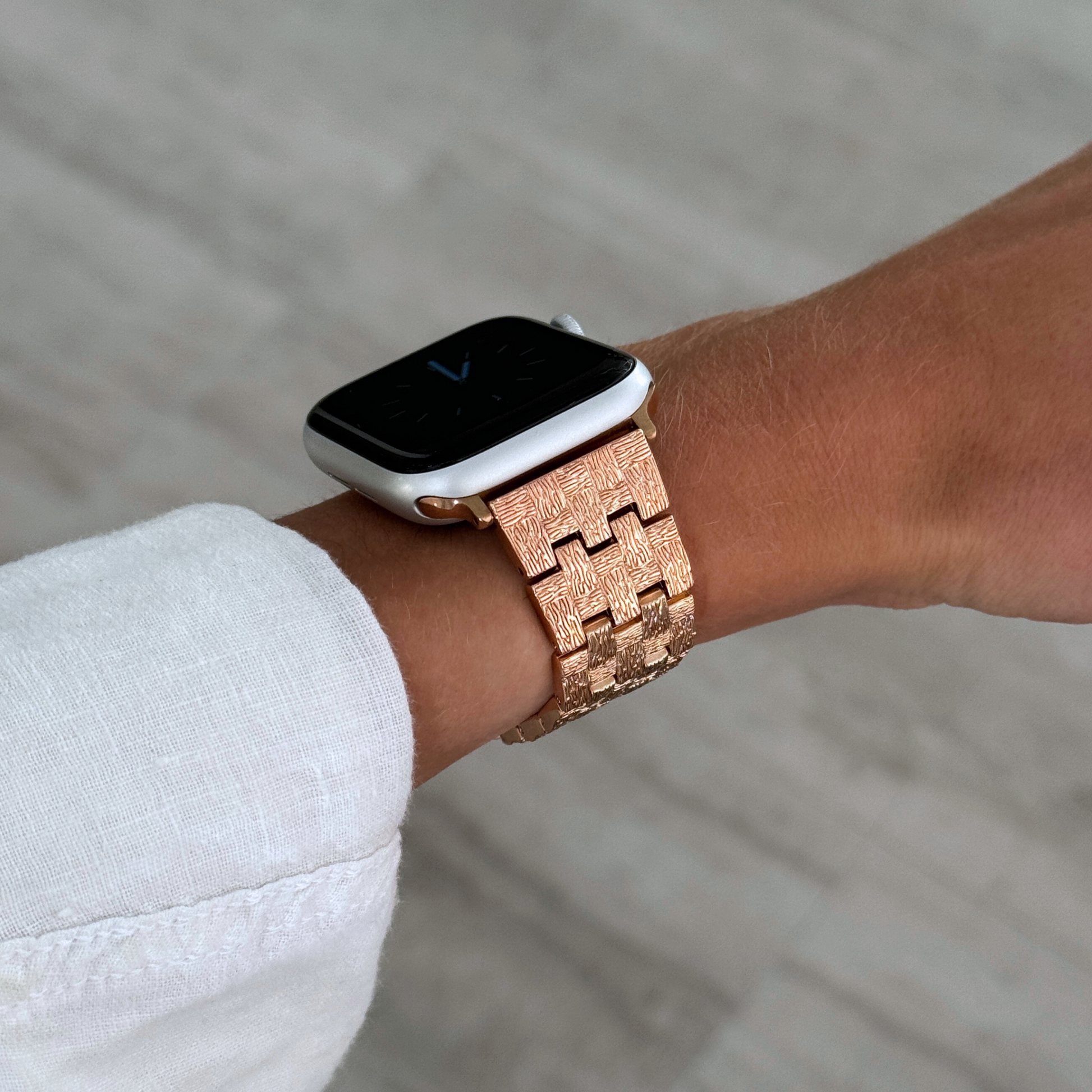 Vintage-inspired stainless steel Apple Watch band with an intricate baroque pattern. Features a mix of brushed matte and polished shine for a luxurious look. Compatible with Apple Watch Series 1-10, SE, and Ultra.