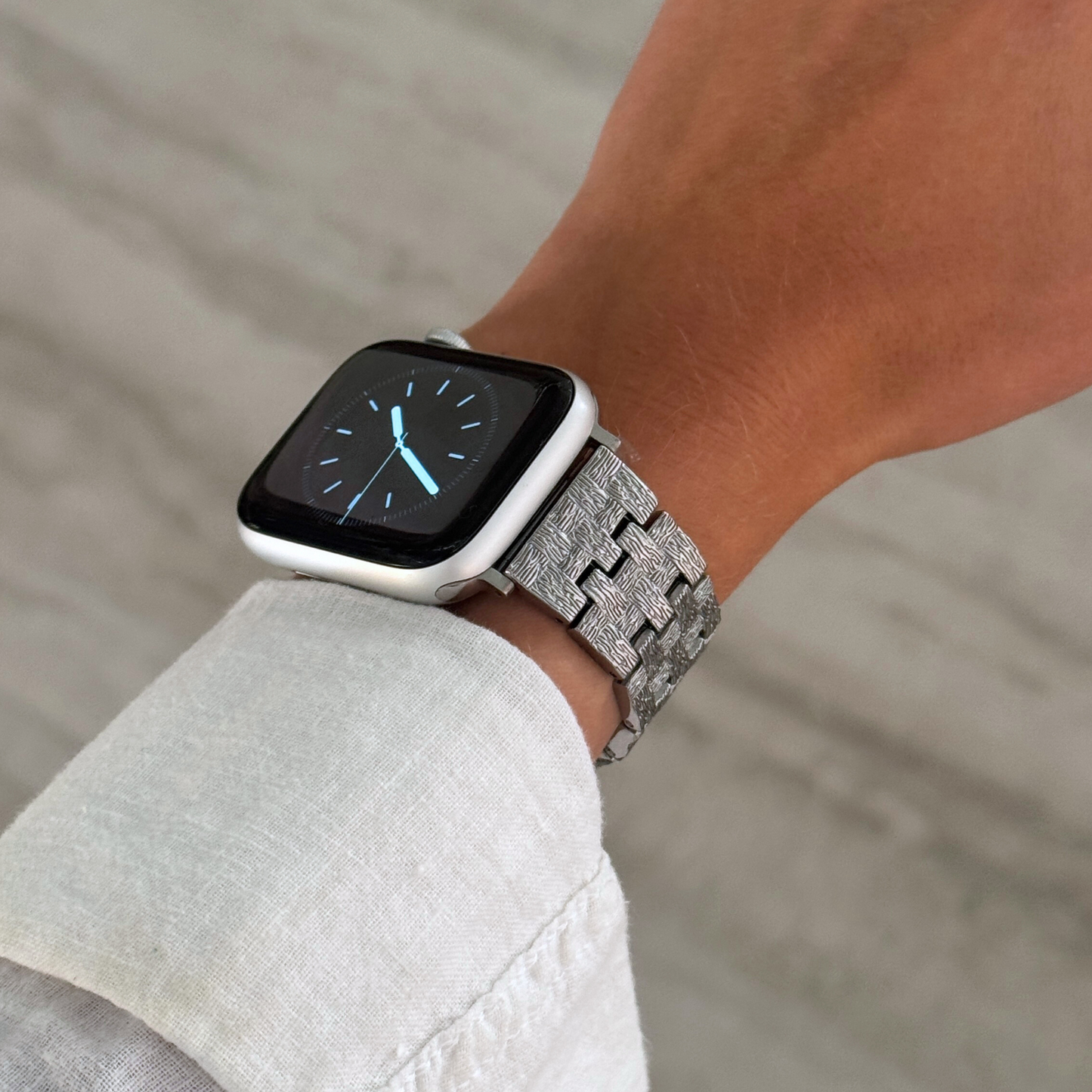 Vintage-inspired stainless steel Apple Watch band with an intricate baroque pattern. Features a mix of brushed matte and polished shine for a luxurious look. Compatible with Apple Watch Series 1-10, SE, and Ultra.