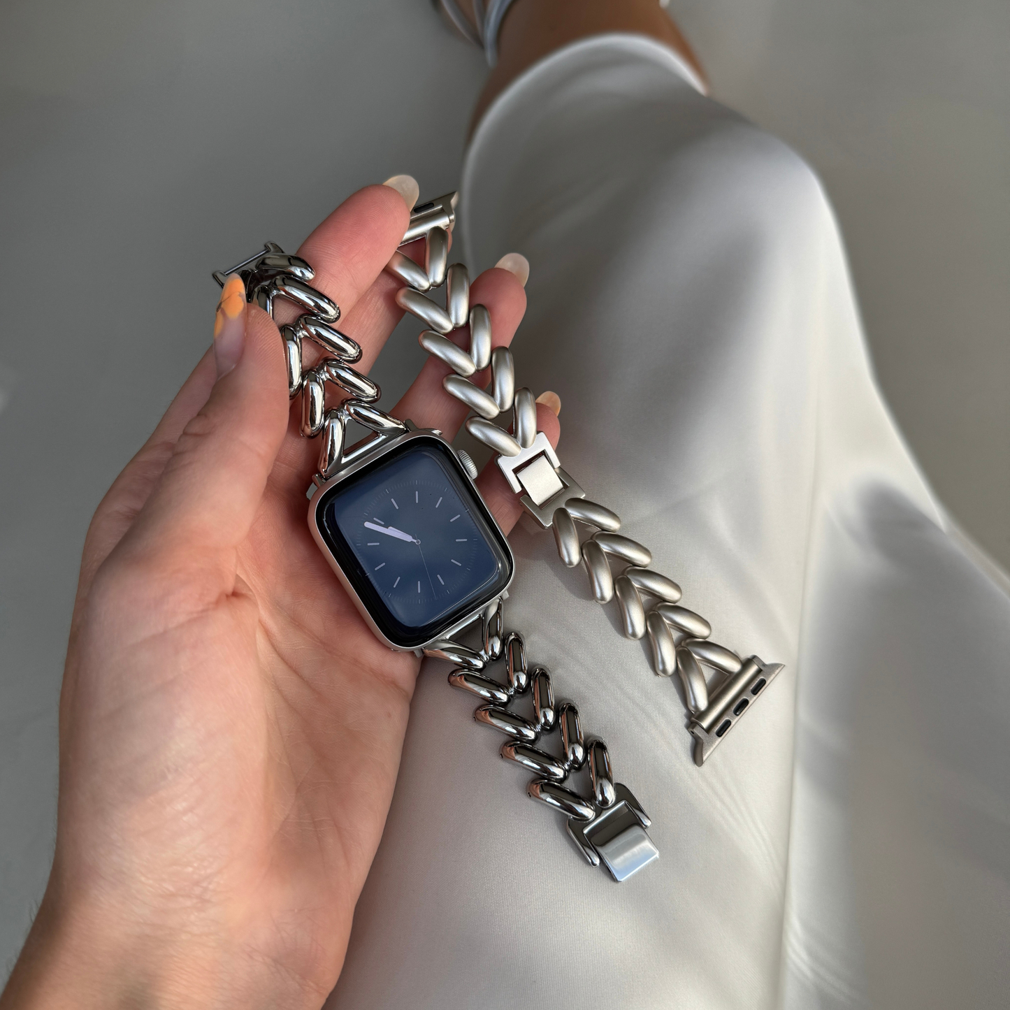Luxurious stainless steel Apple Watch band with a unique, feminine design and a beautiful shine. Elevates any outfit with effortless elegance. Compatible with Apple Watch Series 1-10, SE, and Ultra