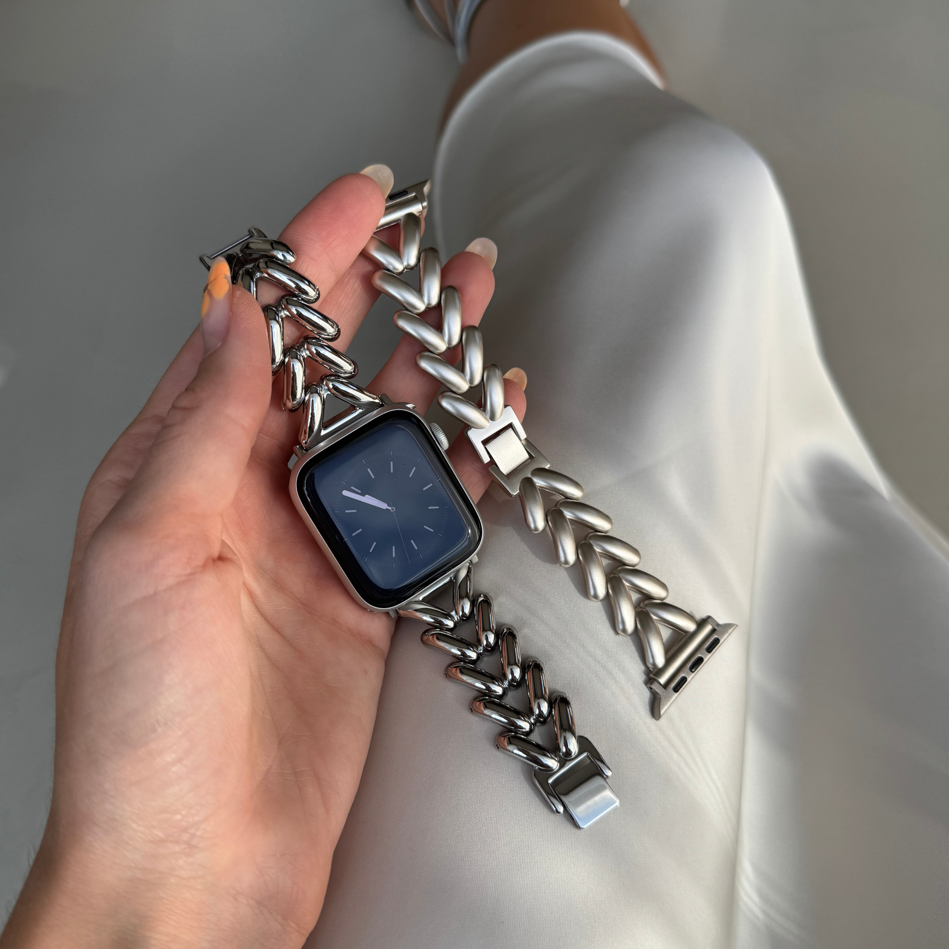 Luxurious stainless steel Apple Watch band with a unique, feminine design and a beautiful shine. Elevates any outfit with effortless elegance. Compatible with Apple Watch Series 1-10, SE, and Ultra