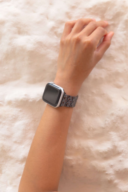 Vintage-inspired stainless steel Apple Watch band with an intricate baroque pattern. Features a mix of brushed matte and polished shine for a luxurious look. Compatible with Apple Watch Series 1-10, SE, and Ultra.