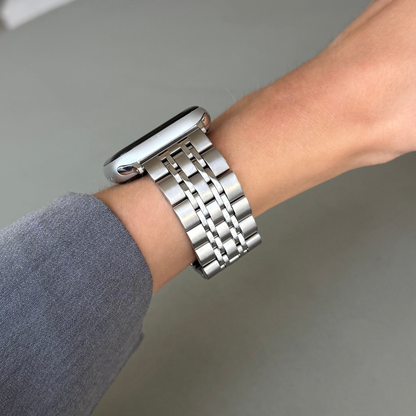 Stainless steel, waterproof Apple Watch band with a minimalist yet classy design and a secure, comfortable clasp. Unisex and high-quality. Compatible with Apple Watch Series 1-10, SE, and Ultra.